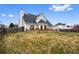 View of the backyard featuring a brick patio, fencing and a storage shed at 2738 Lakewater Way, Snellville, GA 30039