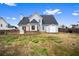 View of the backyard featuring a brick patio, fencing and a storage shed at 2738 Lakewater Way, Snellville, GA 30039
