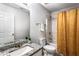 Updated bathroom featuring granite counters, tile floors, and shower-tub combo at 2738 Lakewater Way, Snellville, GA 30039