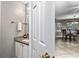 Half bathroom with granite counter and white cabinets at 2738 Lakewater Way, Snellville, GA 30039