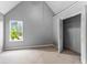 Bedroom featuring a walk-in closet, carpeted floor, and natural light from a window at 2738 Lakewater Way, Snellville, GA 30039