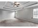 Spacious bedroom features neutral carpet, with natural light from the window at 2738 Lakewater Way, Snellville, GA 30039