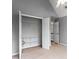 Bedroom with neutral walls and carpet, walk-in closet, and bright natural light at 2738 Lakewater Way, Snellville, GA 30039
