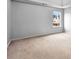 Bedroom with neutral walls and carpet, with a large window for natural light at 2738 Lakewater Way, Snellville, GA 30039
