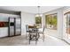 Cozy breakfast nook with stainless refrigerator and natural light from the windows at 2738 Lakewater Way, Snellville, GA 30039