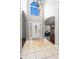 Grand foyer with tile flooring, high ceilings, and an elegant chandelier at 2738 Lakewater Way, Snellville, GA 30039