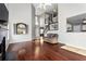 Spacious living room with hardwood floors, fireplace, and staircase at 2738 Lakewater Way, Snellville, GA 30039