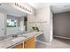 The main bathroom features double vanity sinks, granite countertops, an extended vanity area, and a soaking tub at 2738 Lakewater Way, Snellville, GA 30039