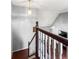 Staircase with hardwood floor and carpet runner at 2738 Lakewater Way, Snellville, GA 30039