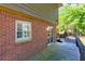Relaxing back deck with brick siding and steps to backyard, provides a perfect blend of indoor/outdoor living at 28 Indian Branch Way, Lawrenceville, GA 30043