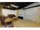 Finished basement showcasing open space and exposed ductwork above at 28 Indian Branch Way, Lawrenceville, GA 30043