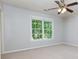 A bright bedroom with a ceiling fan and large windows offering lots of natural light at 28 Indian Branch Way, Lawrenceville, GA 30043
