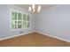 Dining room features hardwood floors, natural light, and modern lighting, perfect for Gathering meals at 28 Indian Branch Way, Lawrenceville, GA 30043