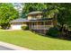 Charming two-story home boasts a brick front, attached garage, a welcoming porch, and a beautifully landscaped yard at 28 Indian Branch Way, Lawrenceville, GA 30043