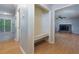Bright hallway featuring hardwood floors, a built-in bench, and doorways leading to other rooms at 28 Indian Branch Way, Lawrenceville, GA 30043