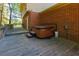 Hot tub located on a spacious wooden deck area, perfect for outdoor relaxation at 28 Indian Branch Way, Lawrenceville, GA 30043