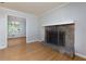 Living room with stone fireplace, hardwood floors, and an open layout provides a cozy and inviting atmosphere at 28 Indian Branch Way, Lawrenceville, GA 30043