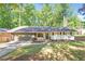 Charming ranch-style home with a well-maintained front yard and attached two car garage at 3708 Canadian Way, Tucker, GA 30084