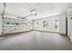 Spacious garage with white walls and cabinets, overhead lighting, and a roll-up door at 3708 Canadian Way, Tucker, GA 30084