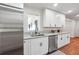 Beautiful kitchen with white cabinetry, stainless steel appliances, and granite countertops at 3708 Canadian Way, Tucker, GA 30084