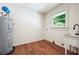 Functional laundry room features a utility sink, and a window for natural light at 3708 Canadian Way, Tucker, GA 30084