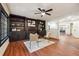 Comfortable living room featuring built-in bookshelves, and hardwood floors at 3708 Canadian Way, Tucker, GA 30084