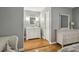 Elegant bathroom with marble vanity and white shaker cabinets, providing a classic and serene space for personal care at 407 River Mill Cir # 407, Roswell, GA 30075