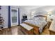 Cozy bedroom with hardwood floors, natural light, and soft blue accents, offering a relaxing retreat at 407 River Mill Cir # 407, Roswell, GA 30075