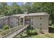 Exterior view of the residential building featuring a quaint walkway at 407 River Mill Cir # 407, Roswell, GA 30075