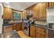 Updated kitchen featuring granite countertops, stainless steel appliances, and wood cabinets at 407 River Mill Cir # 407, Roswell, GA 30075