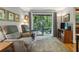 Comfortable living space with nature view and sliding doors to deck at 407 River Mill Cir # 407, Roswell, GA 30075