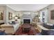 Cozy living room showcasing a fireplace, built-in shelving, and neutral tones at 407 River Mill Cir # 407, Roswell, GA 30075