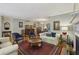 Spacious living room with hardwood floors, fireplace, and elegant furnishings at 407 River Mill Cir # 407, Roswell, GA 30075