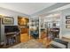 Inviting living room showcasing hardwood floors, open layout to dining and kitchen, and calming light-blue colored walls at 407 River Mill Cir # 407, Roswell, GA 30075
