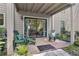 Relaxing outdoor patio includes seating, sliding glass door, and landscape view, perfect for unwinding and enjoying the weather at 407 River Mill Cir # 407, Roswell, GA 30075