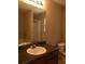 Bathroom featuring large mirror, granite countertop, white sink, and toilet at 4368 Rocky View Dr, Forest Park, GA 30297