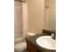 Bathroom with white toilet and shower-tub combo with curtain at 4368 Rocky View Dr, Forest Park, GA 30297