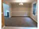 Inviting dining room with warm neutral tones, carpeted floor, and window with blinds for a cozy dining experience at 4368 Rocky View Dr, Forest Park, GA 30297