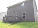 Back exterior view of home with deck, yard and gray siding at 4368 Rocky View Dr, Forest Park, GA 30297