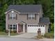 Charming two-story home featuring a gray exterior, attached garage, and well-maintained front lawn and walkway at 4368 Rocky View Dr, Forest Park, GA 30297