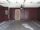 View of garage with stained concrete floors, ceiling fan and door at 4368 Rocky View Dr, Forest Park, GA 30297