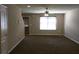 Cozy living room with plush carpet, a bright window, and a ceiling fan for added comfort at 4368 Rocky View Dr, Forest Park, GA 30297