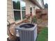 Backyard with shrubbery and AC unit at 101 Dewey Rd, Lilburn, GA 30047