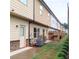 Backyard with AC unit, shrubbery, and fences between townhomes at 101 Dewey Rd, Lilburn, GA 30047