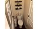 Cozy powder room with stylish decor, floating shelves, and modern fixtures at 101 Dewey Rd, Lilburn, GA 30047
