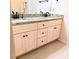 Bathroom vanity featuring double sinks, granite countertops, and modern fixtures at 101 Dewey Rd, Lilburn, GA 30047