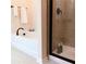 Bright bathroom showcases a soaking tub and shower with elegant tile surround at 101 Dewey Rd, Lilburn, GA 30047