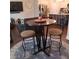 Cozy dining area with a round table, comfortable chairs, and stylish decor at 101 Dewey Rd, Lilburn, GA 30047