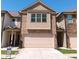 Two-story townhome boasts brick and siding, with a garage and well-maintained lawn at 101 Dewey Rd, Lilburn, GA 30047