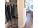 Hallway with closet and view of the living area, featuring hardwood floors at 101 Dewey Rd, Lilburn, GA 30047